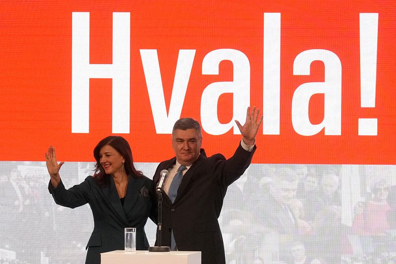 Zoran Milanović and his wife Sanja greet supporters in Zagreb as the preliminary results grant him victory in a runoff vote for the presidency, 12 January, 2025